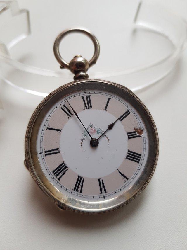 Preview of the first image of Antique ladies ornate solid silver pocket watch 41.5mm.