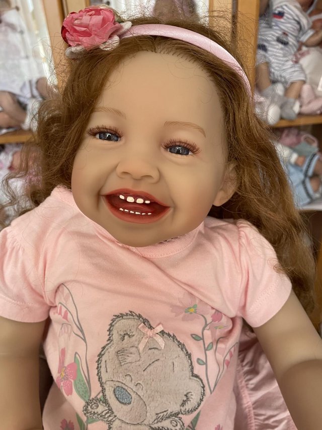 Preview of the first image of Adorable really sweet baby reborn toddler doll girl smiling.