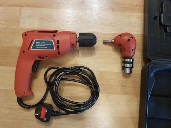 Image 2 of Electric drill with attachment for drilling angles, boxed.