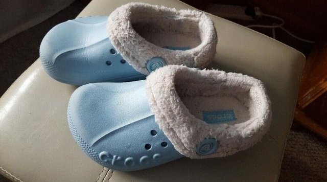 Preview of the first image of Winter Crocs with fleece lining pale blue size junior 2 uk.