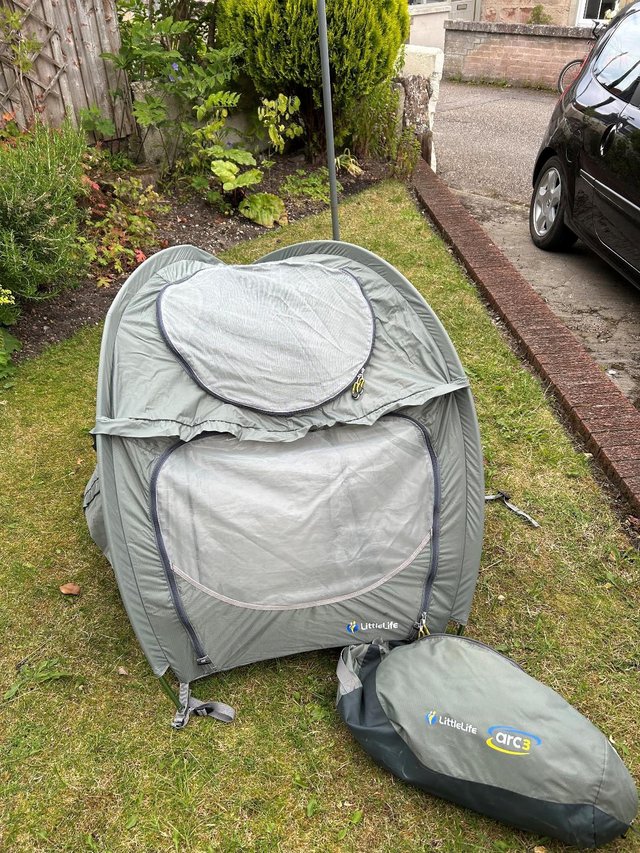 Preview of the first image of Baby travel tent with mosquito netting.