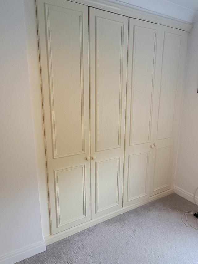 Preview of the first image of 4 wardrobe doors inc: cornice, plinth. 2 bedside tables.