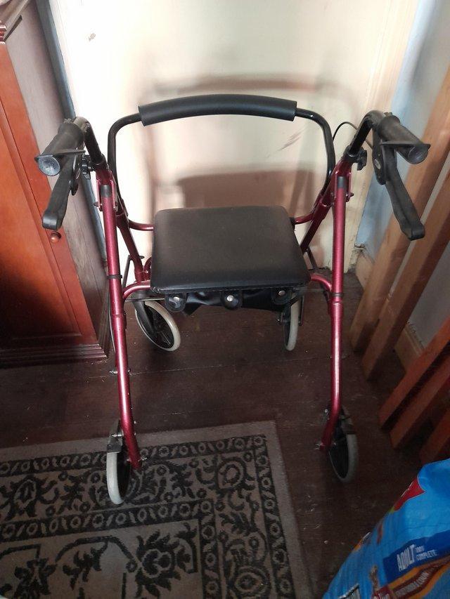 Preview of the first image of Walking frame on wheels with seat.