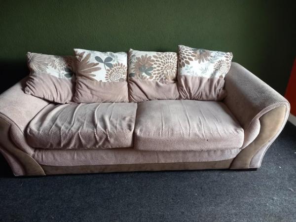 Image 1 of Large cushioned three seater sofa.
