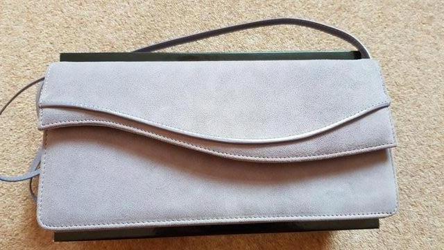 Preview of the first image of Jacques Vert Clutch handbag with strap.