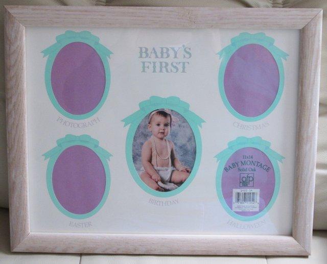 Preview of the first image of Baby Photo frame - new - 11 x 14  holds 5 photos.