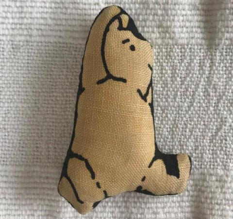 Image 2 of Tiny fabric Winnie the Pooh. Approx max 2” x 1½”
