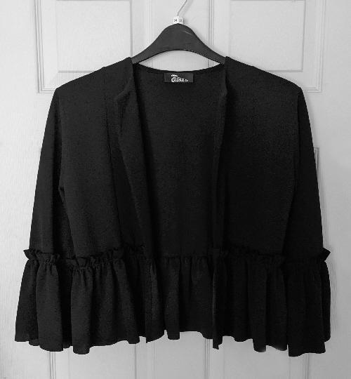 Preview of the first image of Ladies Black Peplum Jacket By Miss Glitz - Size M/L.