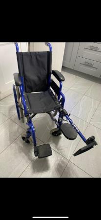 Image 1 of Child’s left leg elevated wheel chair like new