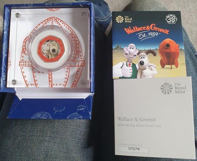 Preview of the first image of R.Mint 2019 Wallace & Gromit Silver Proof Coloured 50p.