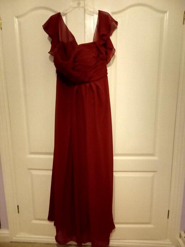 Preview of the first image of New Claret dress size 20 -22 ideal for prom.