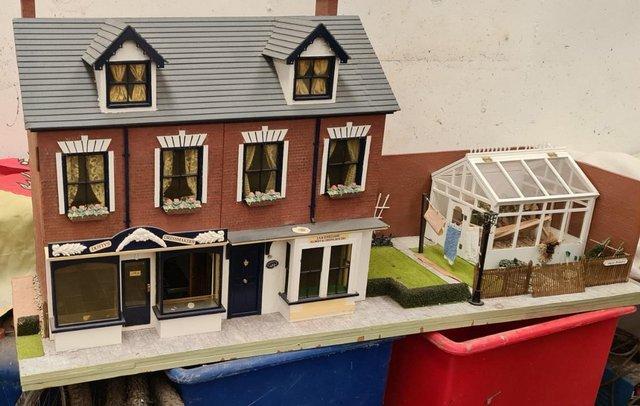 Preview of the first image of DOLLS HOUSE THREE STOREY WITH GARDEN AND GREENHOUSE.