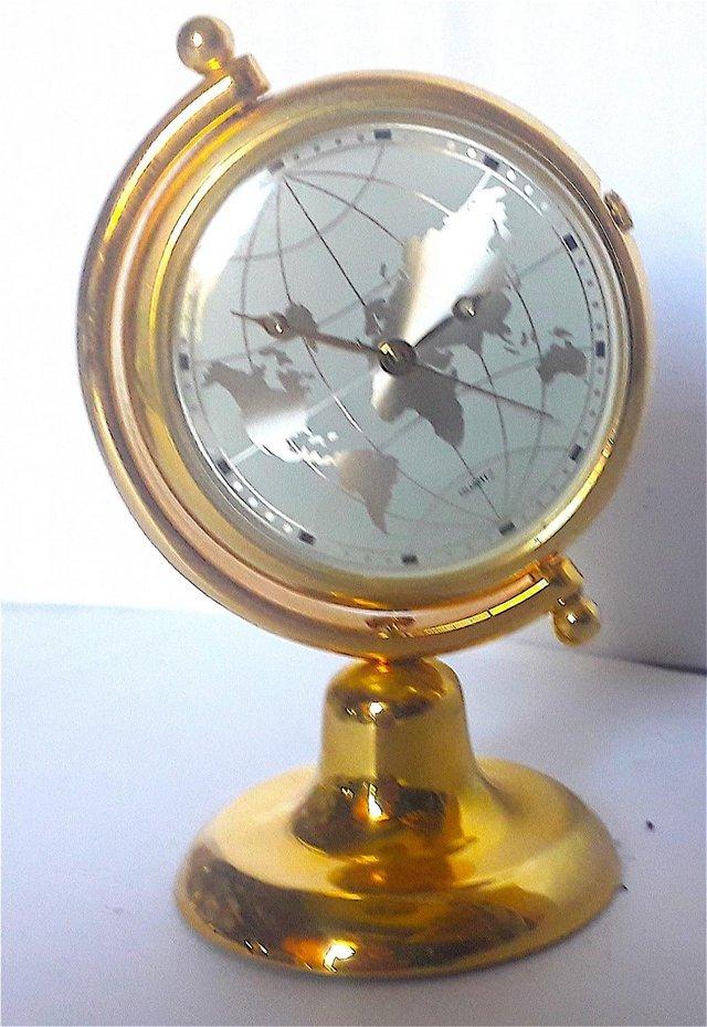 Preview of the first image of MINIATURE NOVELTY CLOCK - ROUND WORLD MAP.