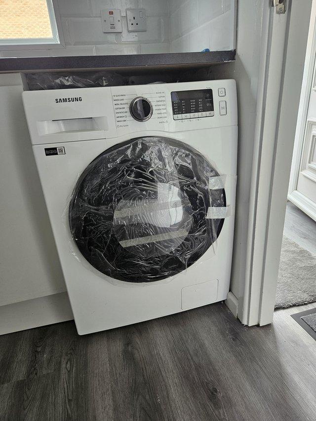 Preview of the first image of Samsung WD90TA046BE_WH Washer Dryer in White.