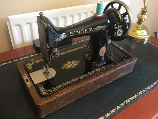 Preview of the first image of Antique hand cranked Singer Sewing Machine.