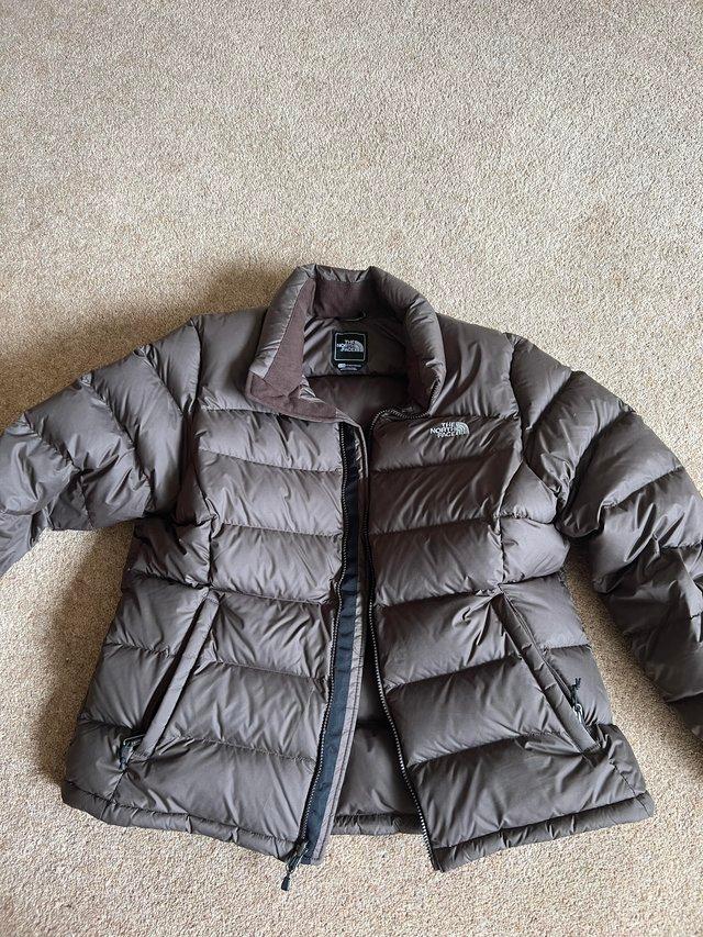 Preview of the first image of Brown women’s North Face coat size 14-16.