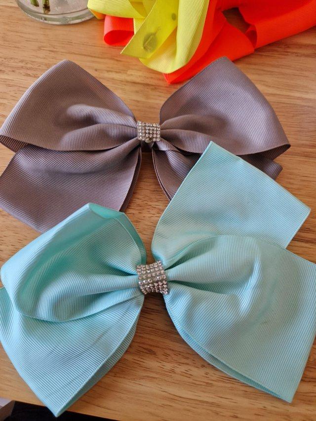 Preview of the first image of 7 Large hair bows for sale.