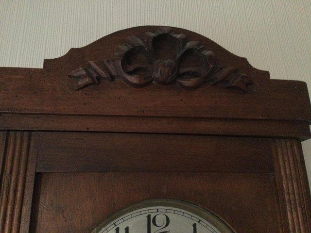 Preview of the first image of Antique wooden wall striking clock.