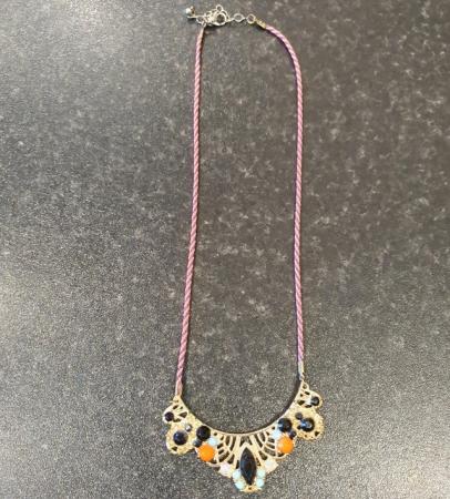 Image 1 of Gold colour necklace with orange, black & blue gemstones