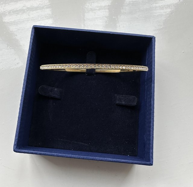 Preview of the first image of Swarovski brand new gold plated bangle.