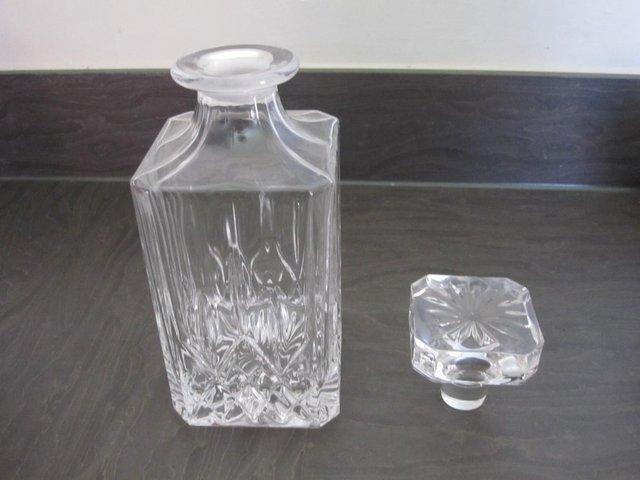 Preview of the first image of Glass Decanter with stopper very heavy.