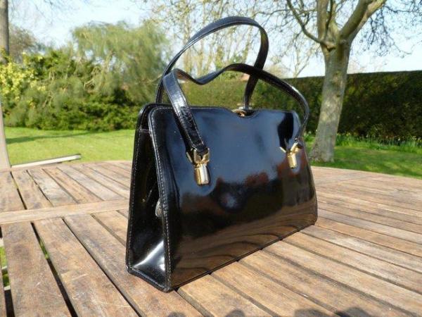Image 1 of Black patent leather handbag by Wigmore of London (inc P&P)