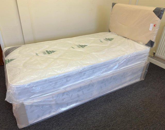 Preview of the first image of York (Lightly quilted) mattress with damask fabric divan.