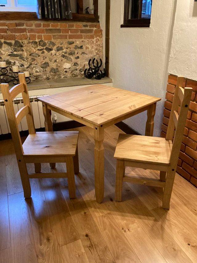 Preview of the first image of Small Wooden table with 2 chairs.