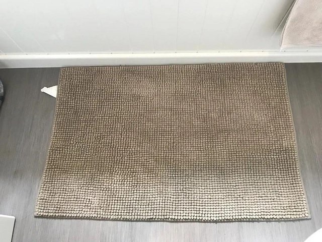 Preview of the first image of IKEA Toftbo brown bath mat.