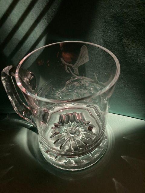 Preview of the first image of Hand engraved stag's head on crystal tankard.