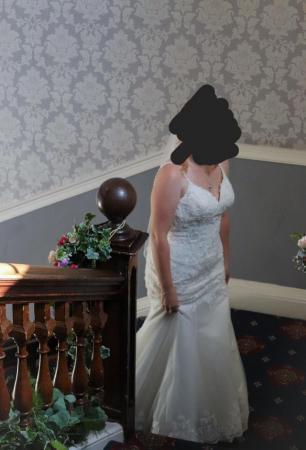 Image 2 of Elite bridal figure hugging wedding dress with matching veil