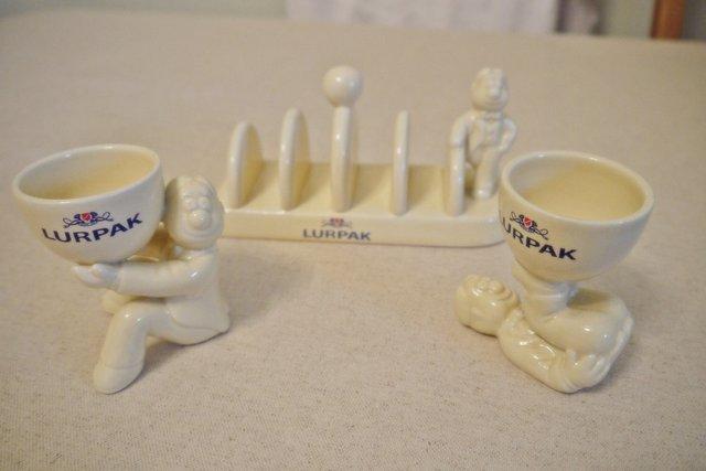 Image 1 of Lurpak toast rack and egg cups.