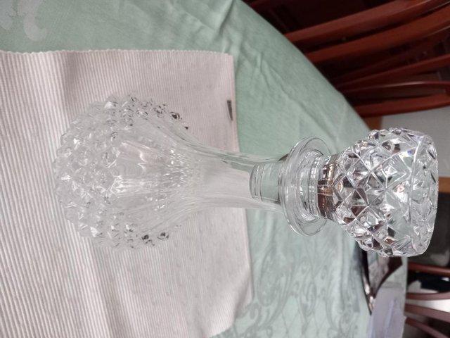 Preview of the first image of Cut glass decanter with unusual round base.