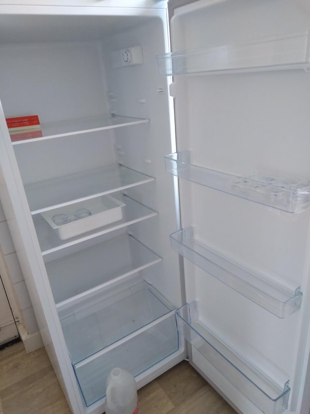 Preview of the first image of Tall larder fridge   with salad tray.