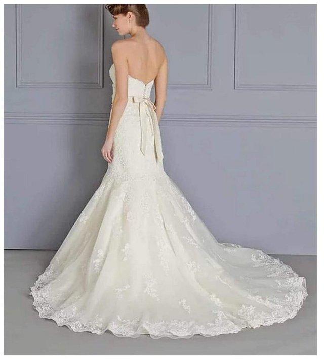 Preview of the first image of Beautiful Ivory wedding dress. Size 12.