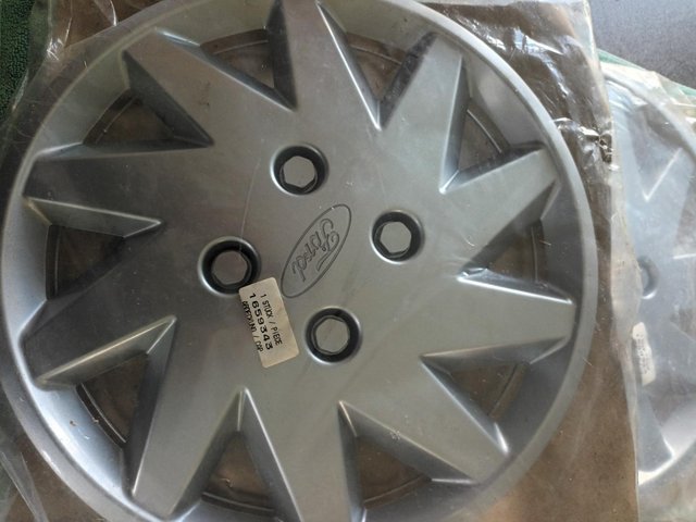 Preview of the first image of TWO ORIGINAL FORD WHEELS TRIMS..