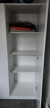 Image 2 of IKEA white three-door wardrobe with shelves