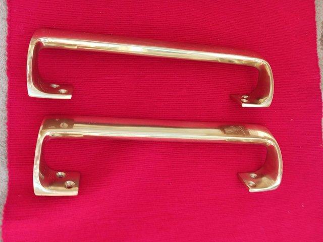 Preview of the first image of Polished brass finish internal door handles.