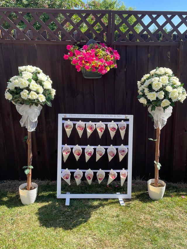 Preview of the first image of Confetti stand and 18 cones filled with dry rose petal.