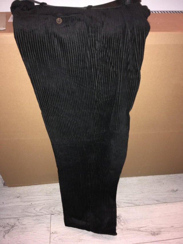 Preview of the first image of BLACK CORDUROY TROUSER, LIKE NEW.