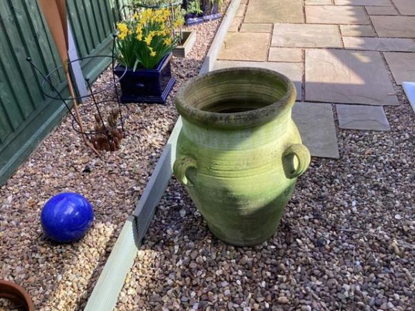 Image 1 of Large green weathered garden urn in good condition
