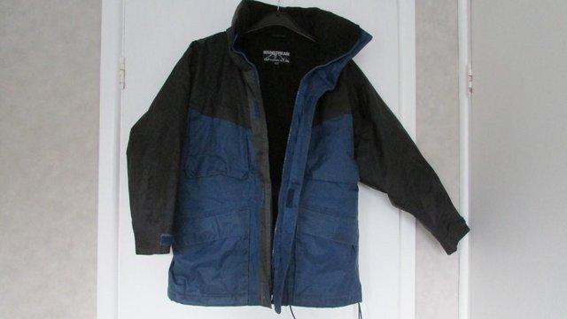 Image 2 of Blue and black fleece lined wipe clean coat 9/10yrs