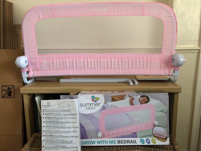 Preview of the first image of **SOLD** Pink bed guard / rail by Summer Infant.