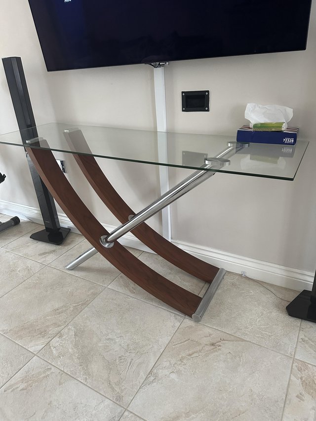 Preview of the first image of Glass console table with wooden arch.