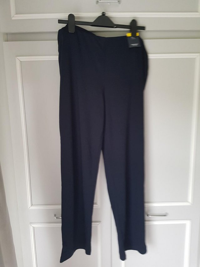 Preview of the first image of M&S Brand new Navy Trousers size 16.