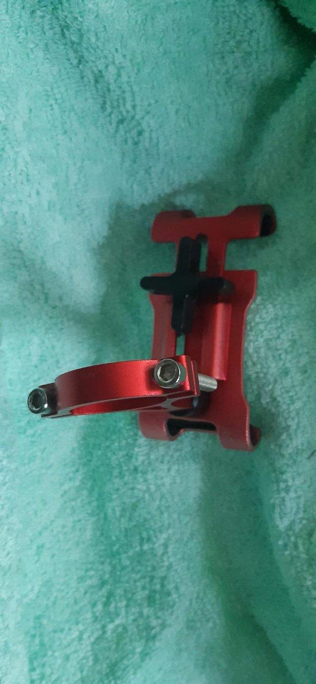 Preview of the first image of Pink / anodised mobile phone holder for bicycle bike.