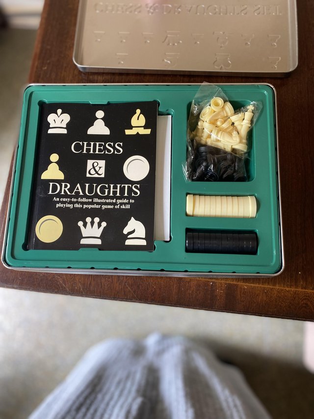 Preview of the first image of Brand new Chess & Draughts game in tin container.