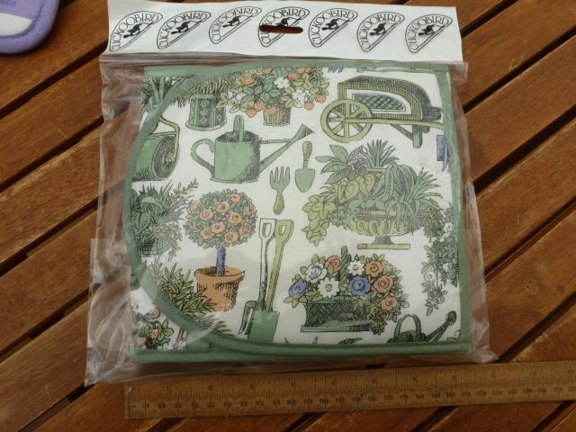 Preview of the first image of Gardening themed oven gloves...............