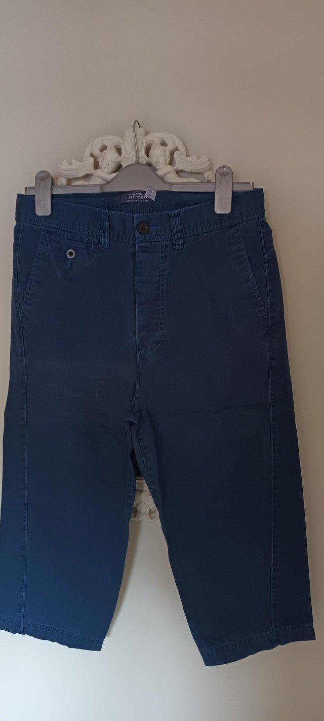 Preview of the first image of TOPMAN Cropped Jean's, blue. UK 30.