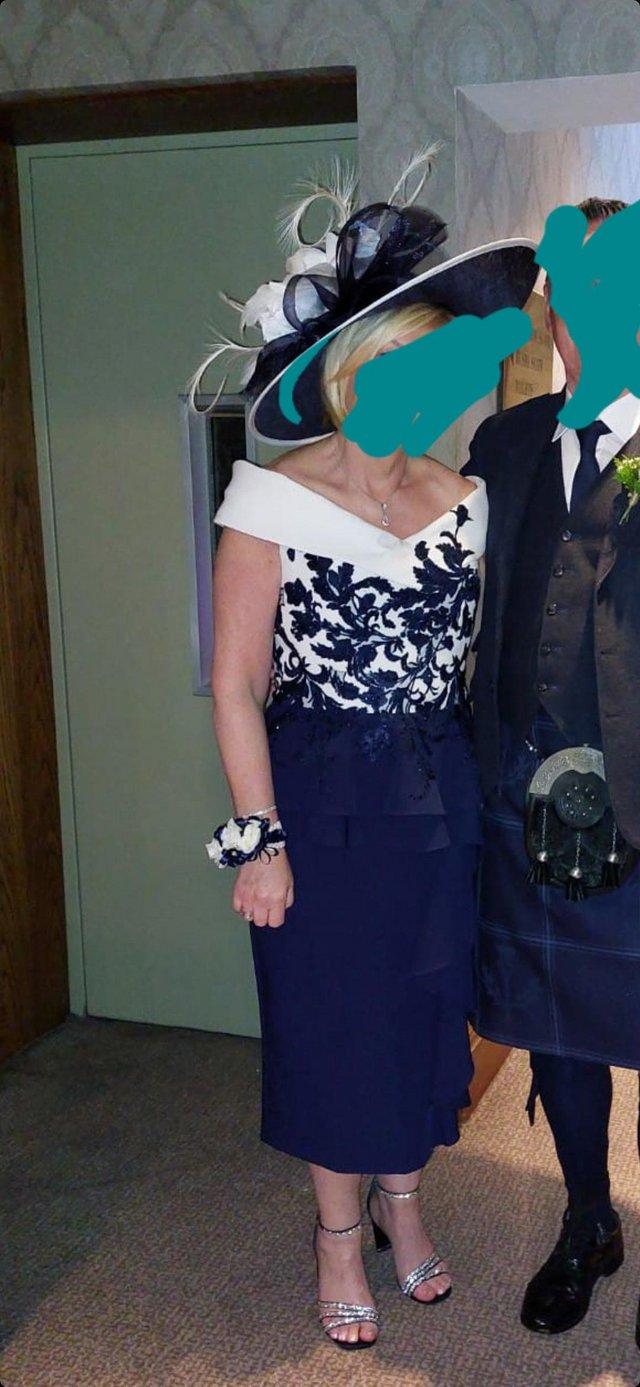 Preview of the first image of Mother off the bride navy and white dress.